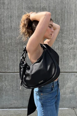 Ganni KNOT BAGUETTE -Fashion Clothing Store Ganni black tech fabric knot baguette bag leather cord piping Pipe and Row seattle