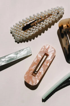 RESIN HAIR BARRETTE CUT OUT RECTANGLE -Fashion Clothing Store resin and pearl hair barrette pipe and row staple